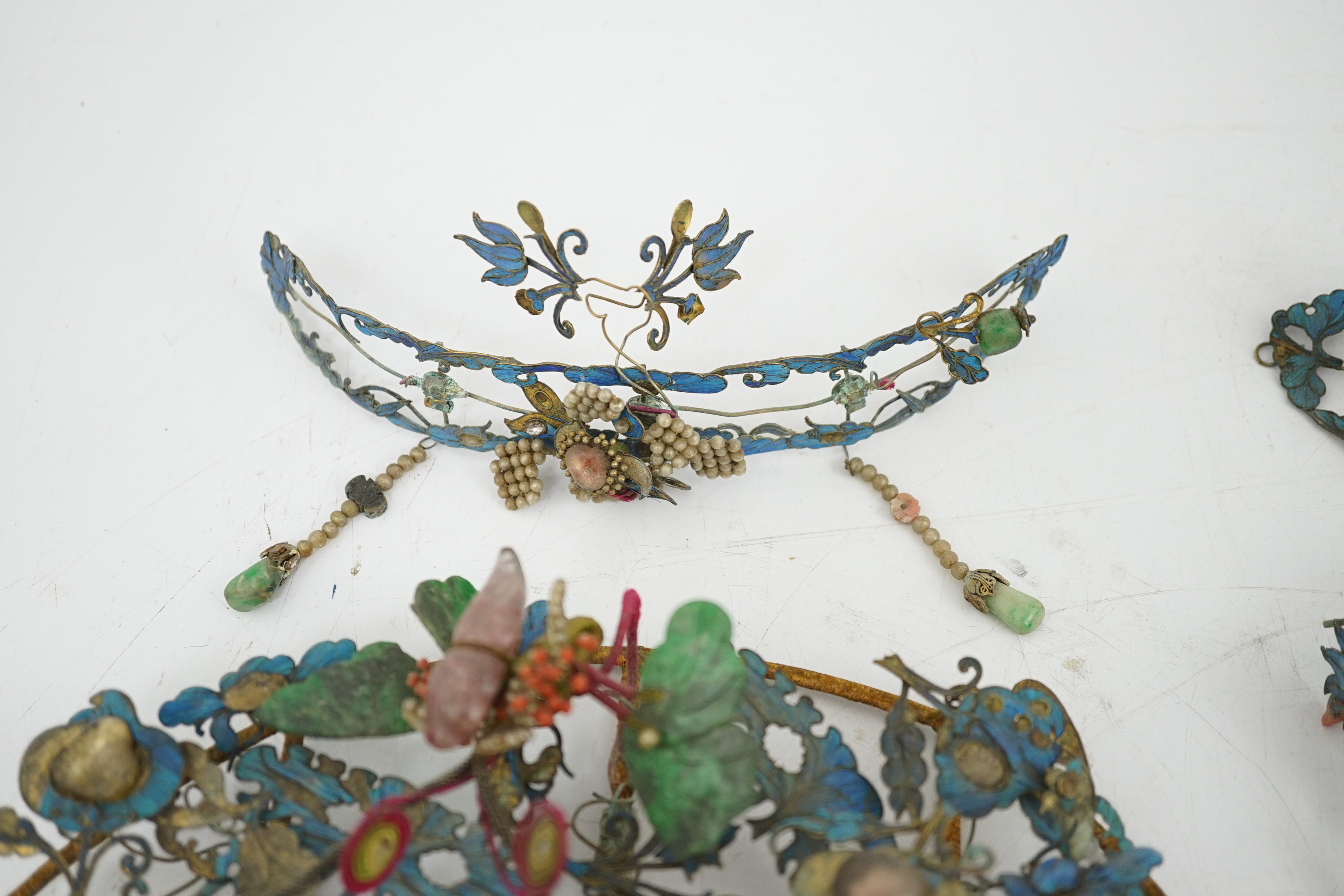 A group of eight Chinese kingfisher feather, jade, seed pearl, coral and hardstone mounted headdresses and ornaments, late Qing dynasty, some losses